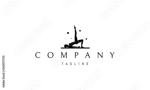 Vector logo on which an abstract image of a girl doing yoga on a mat.