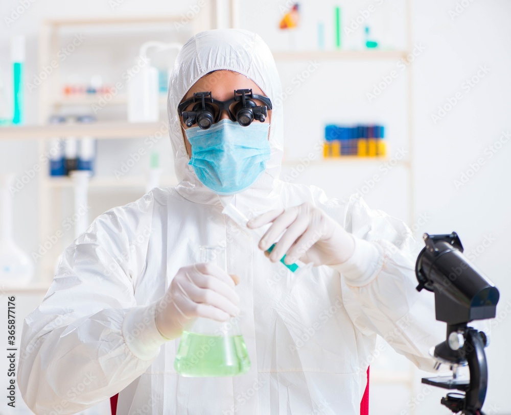 Young chemical scientist working in lab Young chemical scientist working in lab