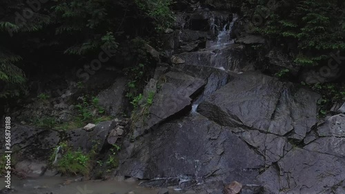Wallpaper Mural Small mountain waterfall, clear water flowing over the stones flowing into the river in the Carpathian mountains Torontodigital.ca