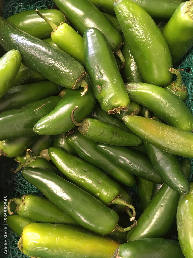 Fresh organic chili peppers at a farm market stand displayed for sale Fresh organic chili peppers at a farm market stand displayed for sale