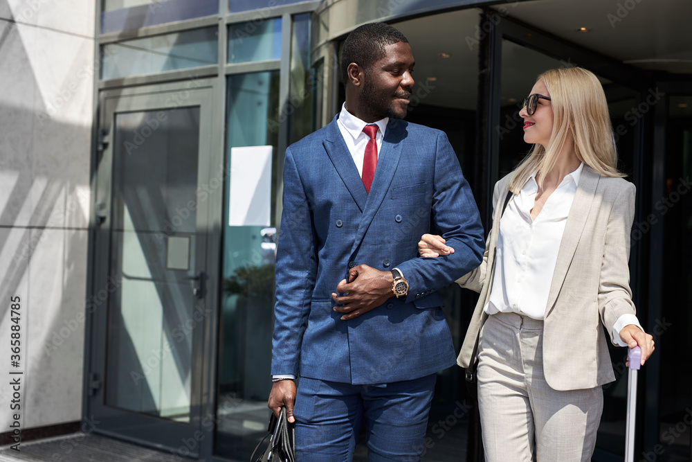 polite bellboy help clients to carry their baggage to the car, attractive business lady like work of hotel staff, enjoy business trip polite bellboy help clients to carry their baggage to the car, attractive business lady like work of hotel staff, enjoy business trip