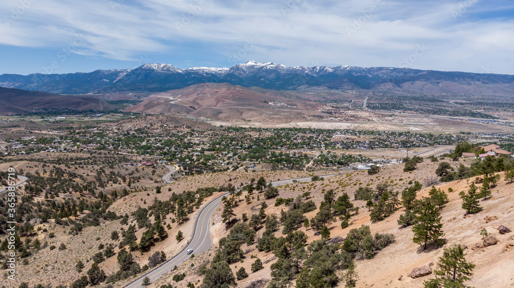 Drone photo over traffic going up mountain roads on Geiger grade near Virginia City