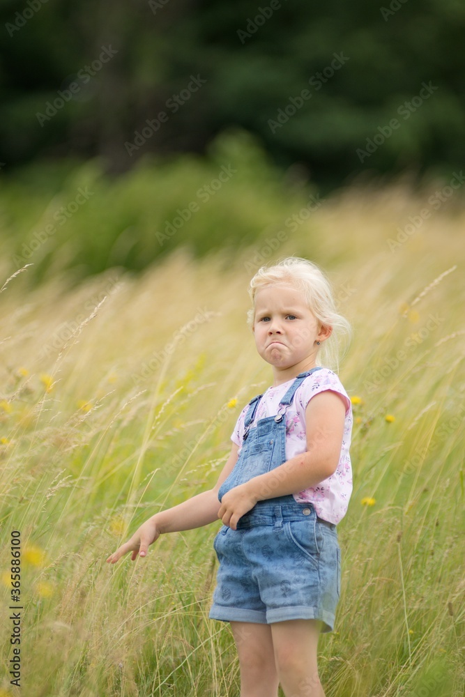 Little girl on a trip in nature, laughter and emotion on her face. Little girl on a trip in nature, laughter and emotion on her face.