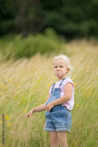 Little girl on a trip in nature, laughter and emotion on her face.