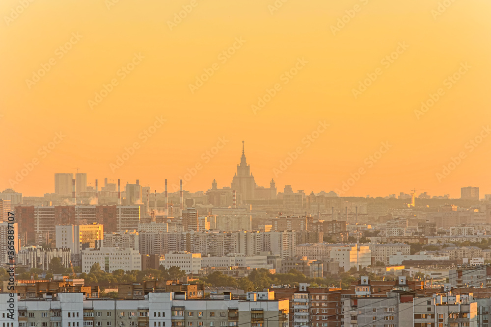 Cityscape of Moscow city in Russia during golden sunset. Small haze in the air. Golden hour theme.
