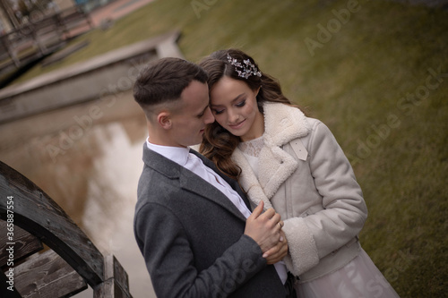 beautiful couple, bride and groom in long dress, part, wedding, girl with curvy hair