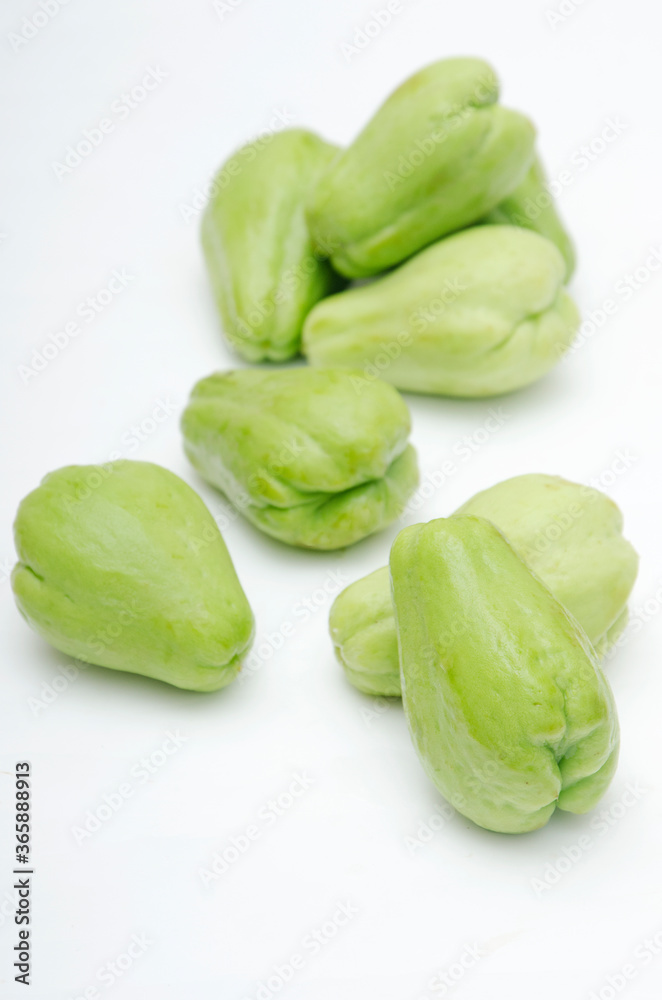 green and fresh chayote in white background green and fresh chayote in white background