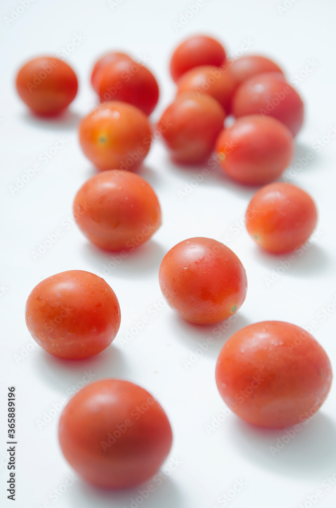 Tomato and fresh vegetables on a isolated in white background Tomato and fresh vegetables on a isolated in white background
