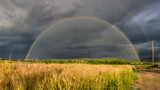 Rainbow after rain on a sumer afternoon over the rye field in Drama Greece