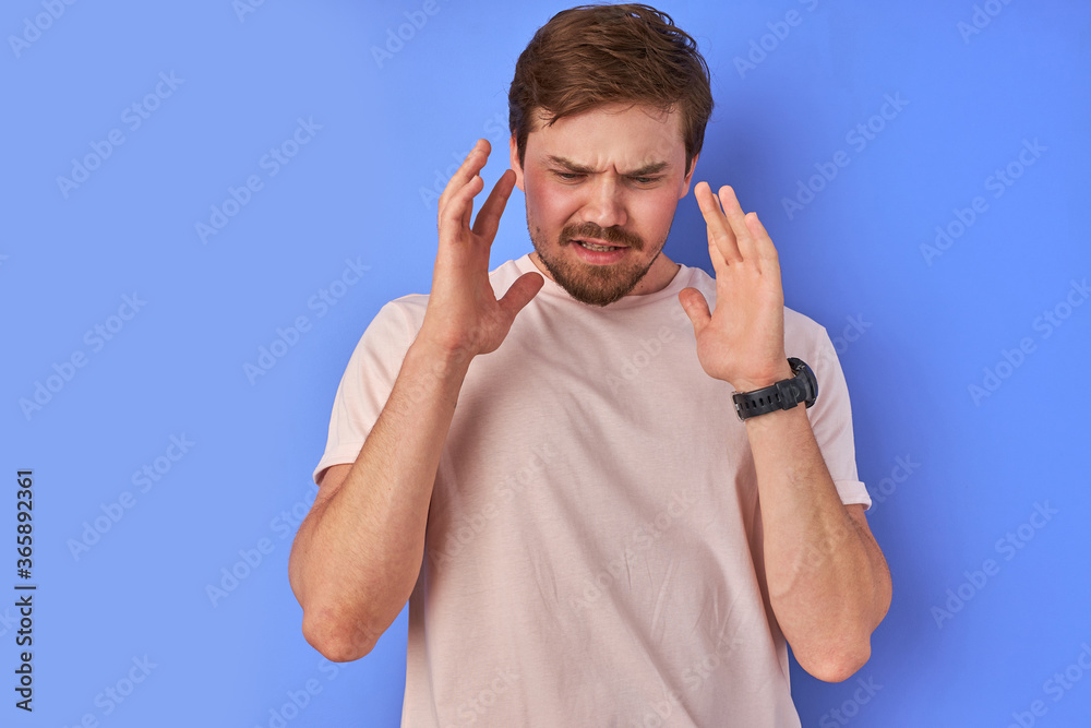 Fototapeta premium irritated guy denies everything, caucasian bearded man dissatisfied with news, feel negative emotions