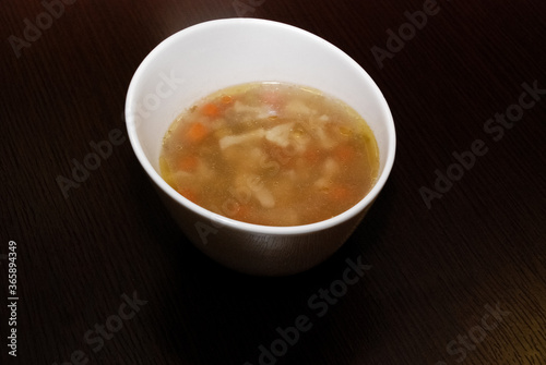 vegetable soup served in the white bowl