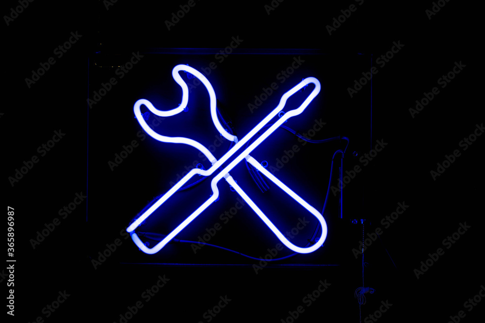 Glowing Neon Signs Hanging on a wall Glowing Neon Signs Hanging on a wall