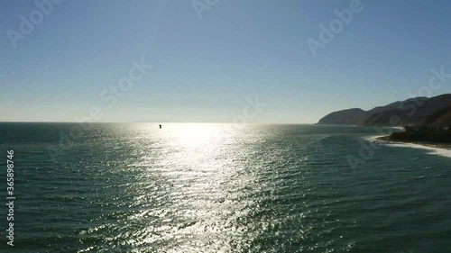 Kite Surfer in Ocean Sunset Horizon Drone