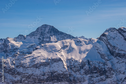 Beautiful panoramic view of snow-capped mountains in the Swiss Alps.