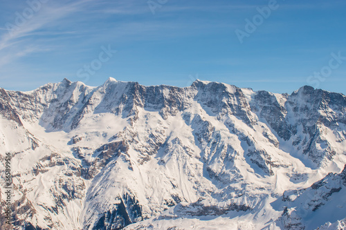 Beautiful panoramic view of snow-capped mountains in the Swiss Alps.