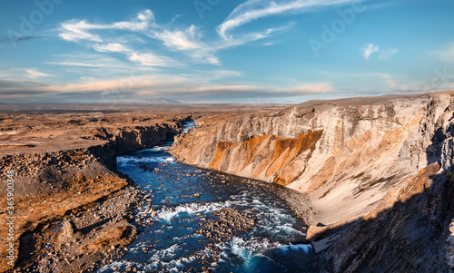 Scenic Image of nature. Wonderful Sunny day of Iceland. Tipical icelandic landscape of summer. Majestic basalt canyon, powerful river and perfect sky. Iceland Best country for travel locations.