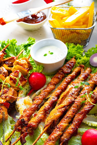 Grilled szaszlyk and meat flares with green salad photo