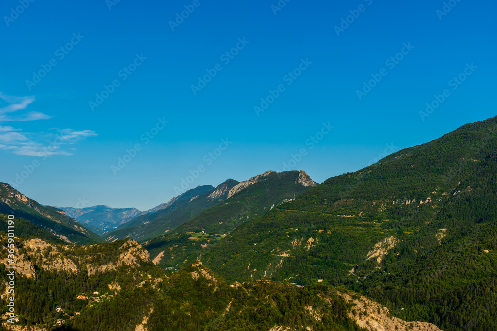 A picturesque landscape view of the Alps mountains in the evening during sunset (Puget-Theniers, Alpes-Maritimes, France)