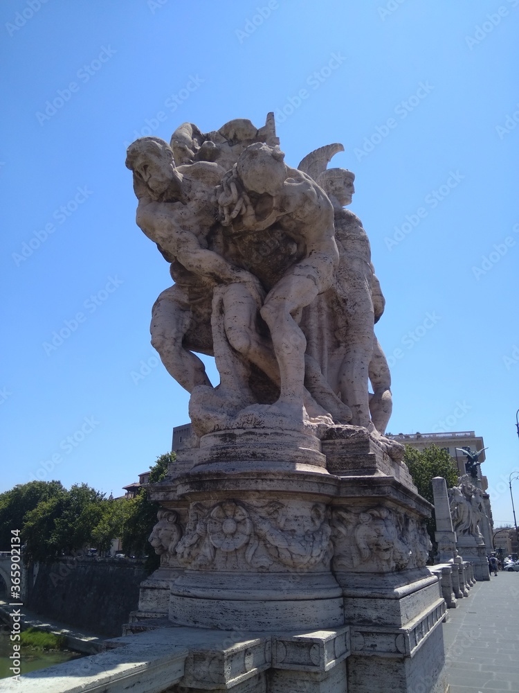 Sculpture on the bridge over the Tiber river in Rome in Italy.