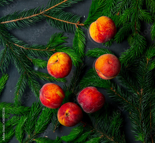 group of peaches with leaves and Christmas tree branches