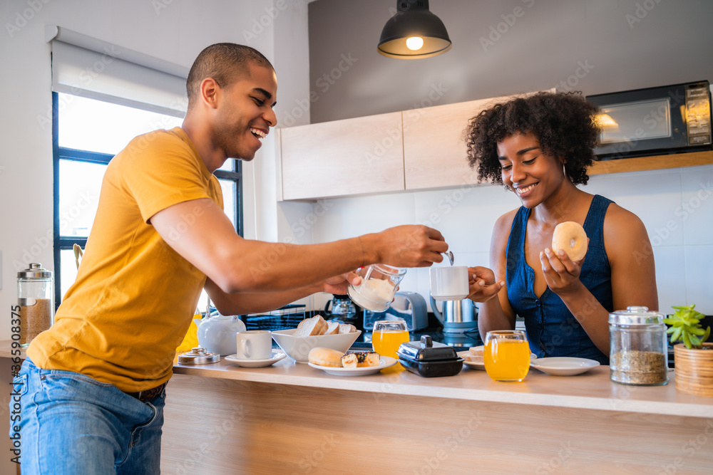 Young couple having breakfast at home. Young couple having breakfast at home.