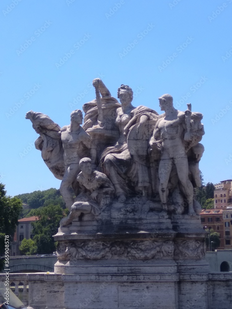 Sculpture on the bridge over the Tiber river in Rome in Italy.