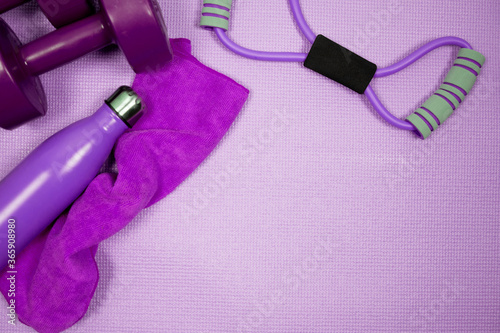 violet exercise equipment for sports activities on ground with violet background