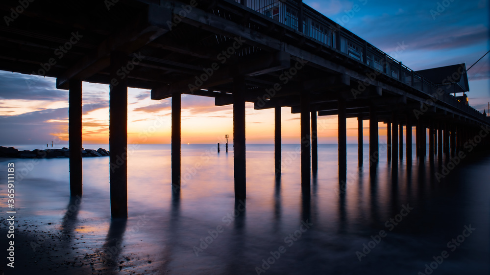 sunrise under the pier