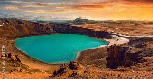 Incredible nature of Iceland during sunset. Fantastic dramatic scene with colorful sky over the Viti crater in Krafla volcanic area. Famous travel locations. Creative artistic Image. photo