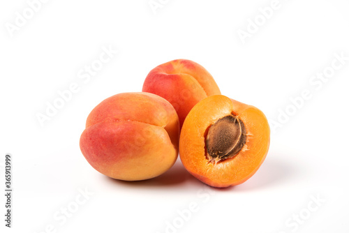 Fresh yellow apricots isolated on white