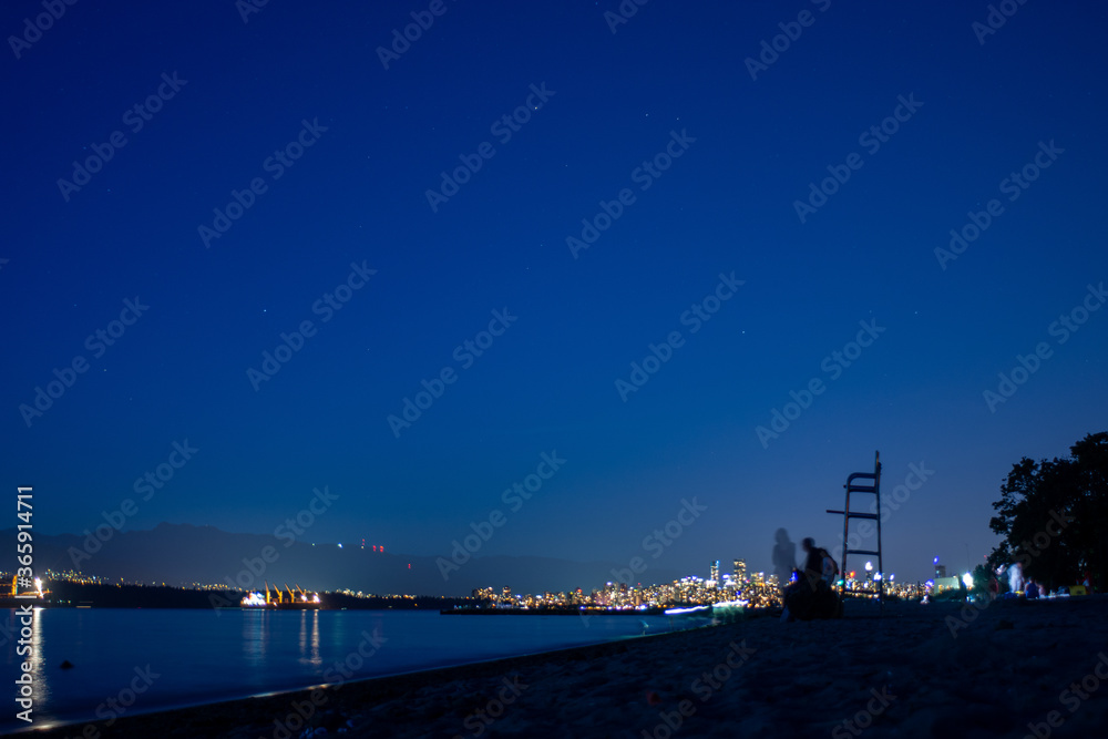 A evening view of Vancouver downtown from spanish bank.   Vancouver BC Canada
