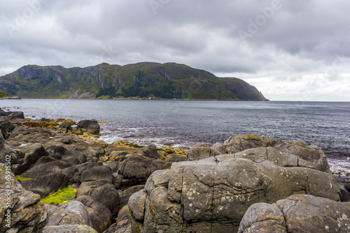 rainy clouds over the Kannesteinen rock on the coast of Norway photo