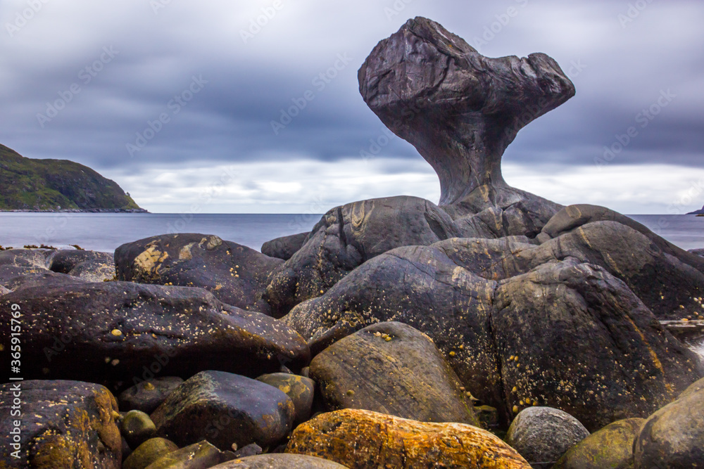 rainy clouds over the Kannesteinen rock on the coast of Norway rainy clouds over the Kannesteinen rock on the coast of Norway