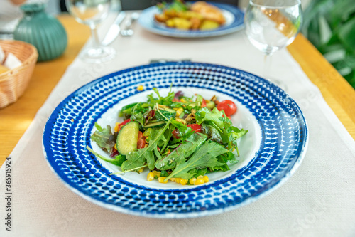 fresh vegetable salad served on a table in a restaurant