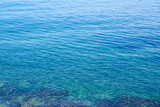Waving surface of a clear blue water as a natural background. Blue lagoon.