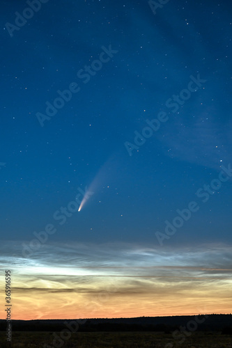 Noctilucent Clouds and Comet C 2020 F3 Neowise in the night sky.