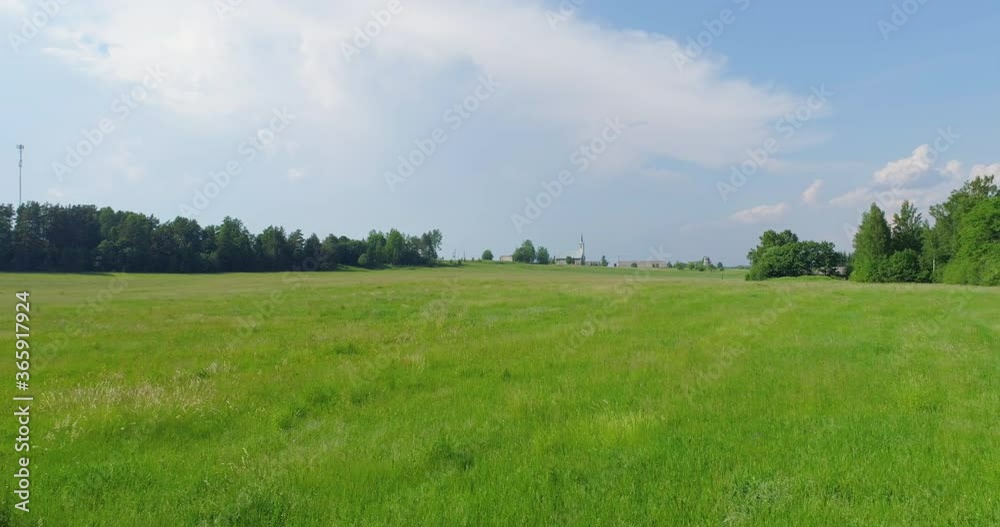 Aerial view of cloudy sunny day. Countryside surrounded by green fields, rivers and trees. Aerial view of cloudy sunny day. Countryside surrounded by green fields, rivers and trees.