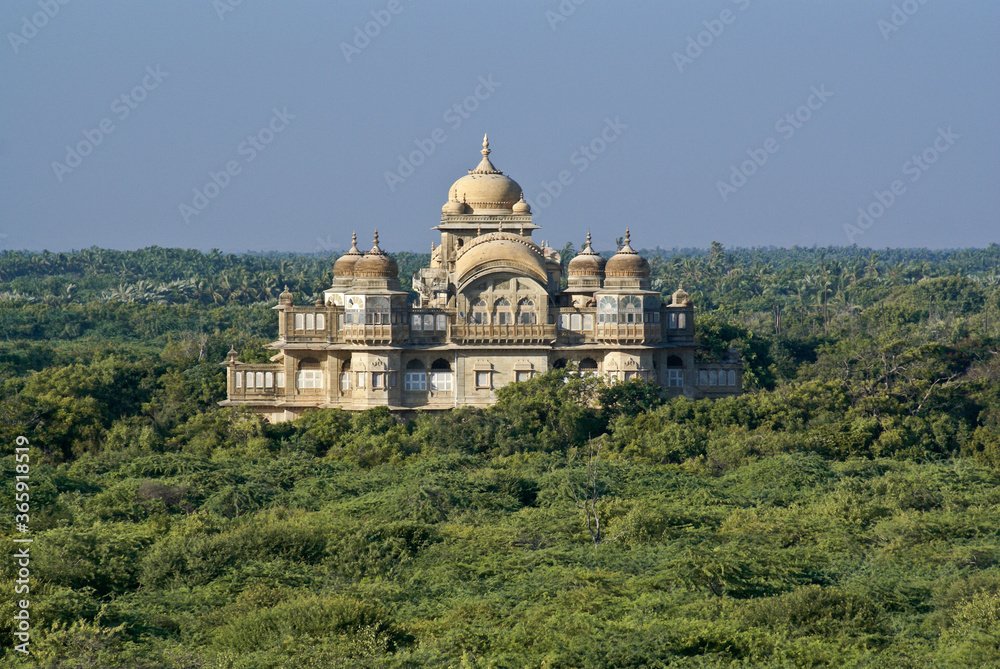 The historic Vijaya Vilas Palace sits amidst tropical vegetation near Mandvi, Gujarat, India