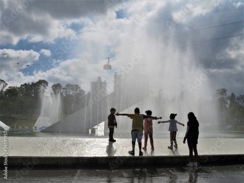 children playing in the fountain, Mexico