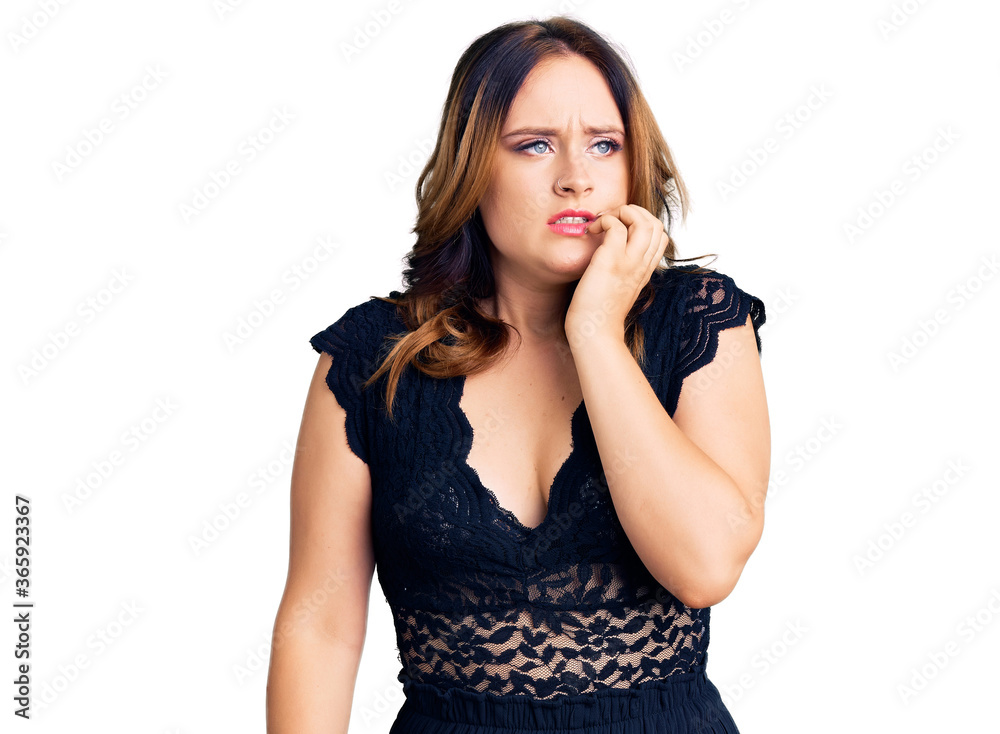 Young beautiful caucasian woman wearing elegant dress looking stressed and nervous with hands on mouth biting nails. anxiety problem. Young beautiful caucasian woman wearing elegant dress looking stressed and nervous with hands on mouth biting nails. anxiety problem.