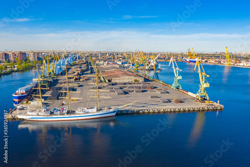 Sailing ship moored in port. Ship without sails near shore. Sea port view from a drone. Offshore loading terminal with quadcopter. Sailing ship without sails. Concept - shipbuilding.