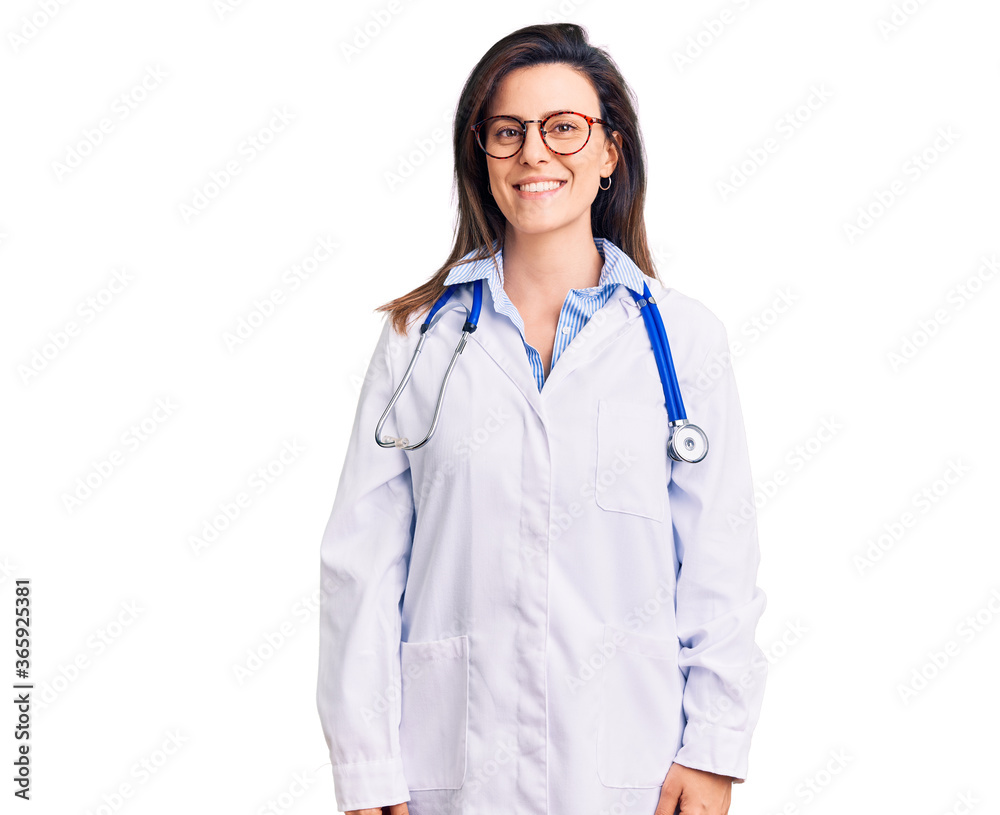 Young beautiful woman wearing doctor stethoscope and glasses with a happy and cool smile on face. lucky person.