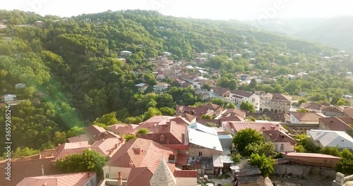 4K Sighnaghi Georgia Best View From Downtown Buildings Architecture, Historical Church & Green Caucasus Forest Landscape in Sunset Golden Time in Georgia photo