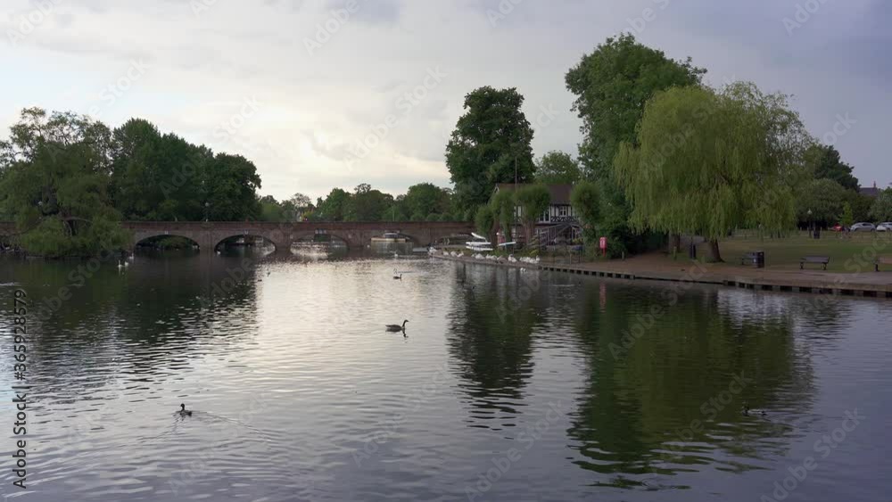View of the river Avon in Shakespeares birth town of Stratford upon Avon on a bright summer late evening. Warwickshire, England, UK View of the river Avon in Shakespeares birth town of Stratford upon Avon on a bright summer late evening. Warwickshire, England, UK