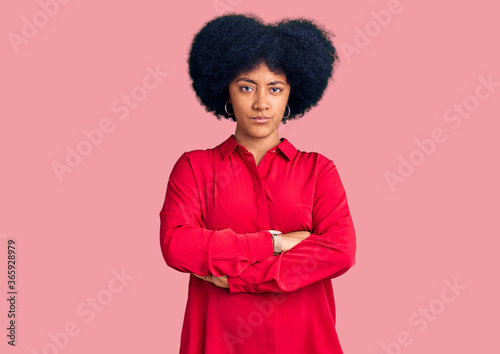 Young african american girl wearing casual clothes skeptic and nervous, disapproving expression on face with crossed arms. negative person.