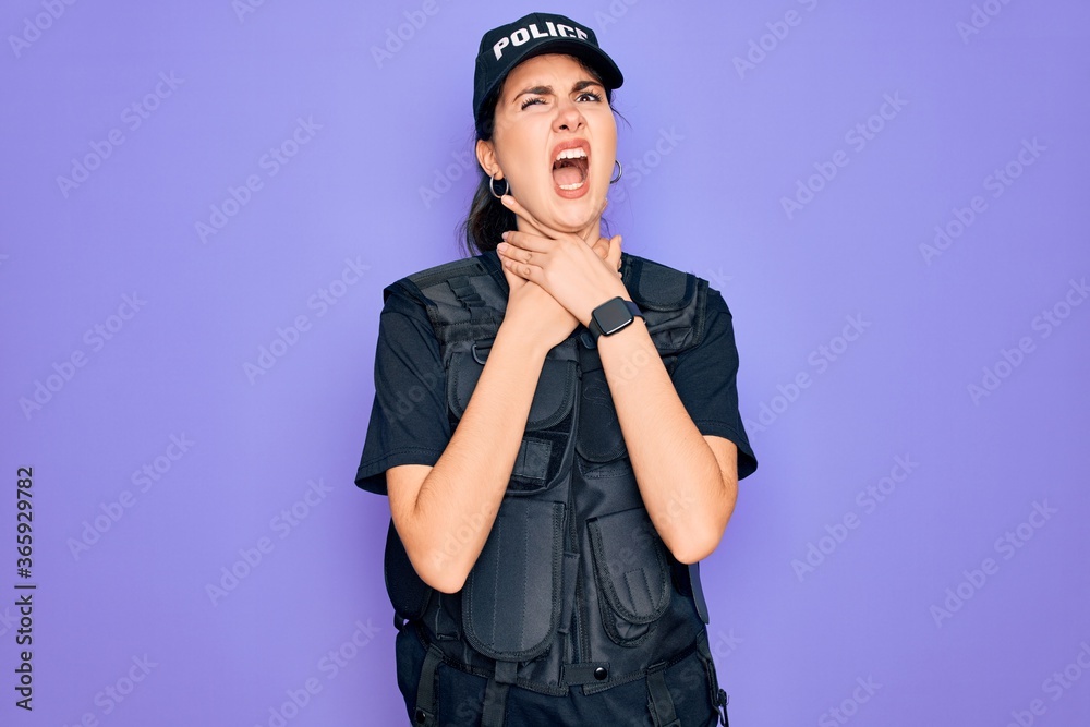 Young police woman wearing security bulletproof vest uniform over purple background shouting suffocate because painful strangle. Health problem. Asphyxiate and suicide concept. Young police woman wearing security bulletproof vest uniform over purple background shouting suffocate because painful strangle. Health problem. Asphyxiate and suicide concept.