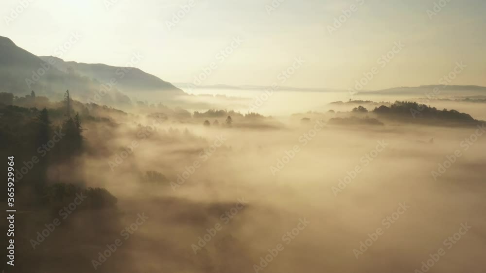 Drone video golden light Lake District National Park in summer cloud inversion mist Elterwater Valley Langdale Beautiful England Mountains Natural UK Landscape Drone video golden light Lake District National Park in summer cloud inversion mist Elterwater Valley Langdale Beautiful England Mountains Natural UK Landscape
