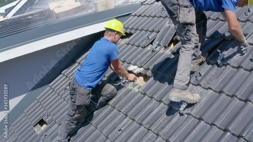 Wallpaper Mural Static footage of two workers drilling and preparing the roof of a house for installation of solar panels. Concept of professionalism,Job,solar power,renewable energy. Torontodigital.ca