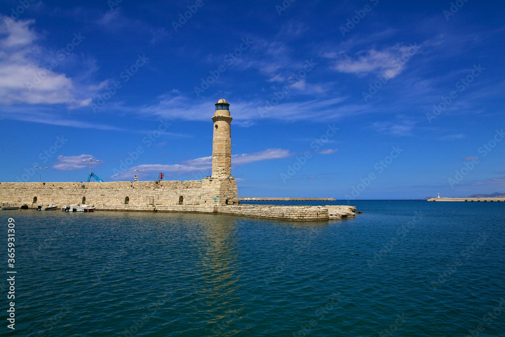 Old Venetian harbour with a view of the lighthouse on a clear Sunny day. City of Chania, Crete