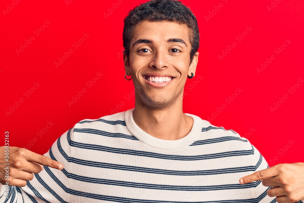 Young african amercian man wearing casual clothes looking confident with smile on face, pointing oneself with fingers proud and happy. Young african amercian man wearing casual clothes looking confident with smile on face, pointing oneself with fingers proud and happy.